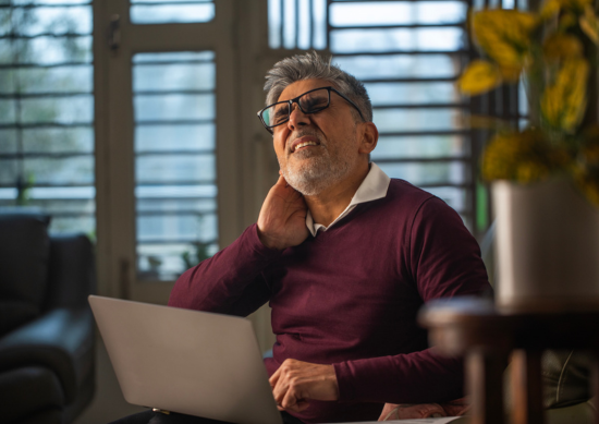 Man holding his neck in pain