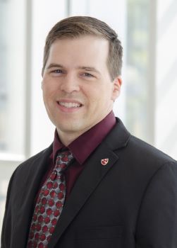 Man standing in a dark jacket