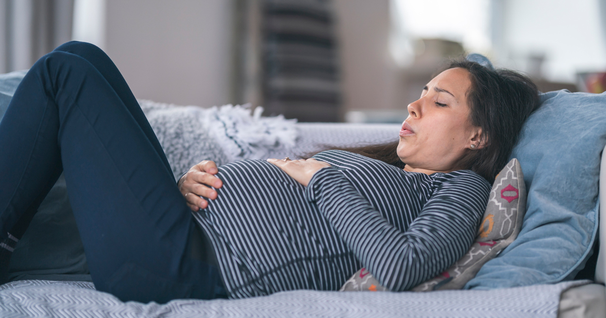 Pregnant woman on couch