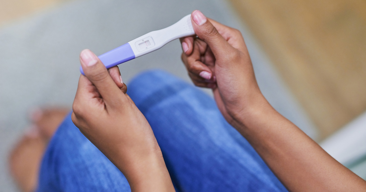 Home pregnancy test being held