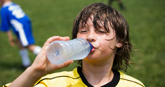 picture of a thirsty kid at a soccer match