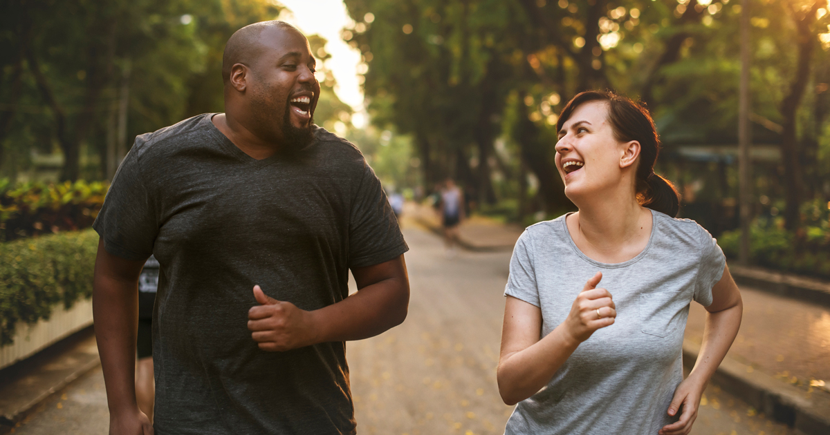 A man and a woman on a run together