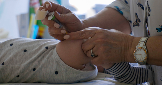 photo of a baby being vaccinated