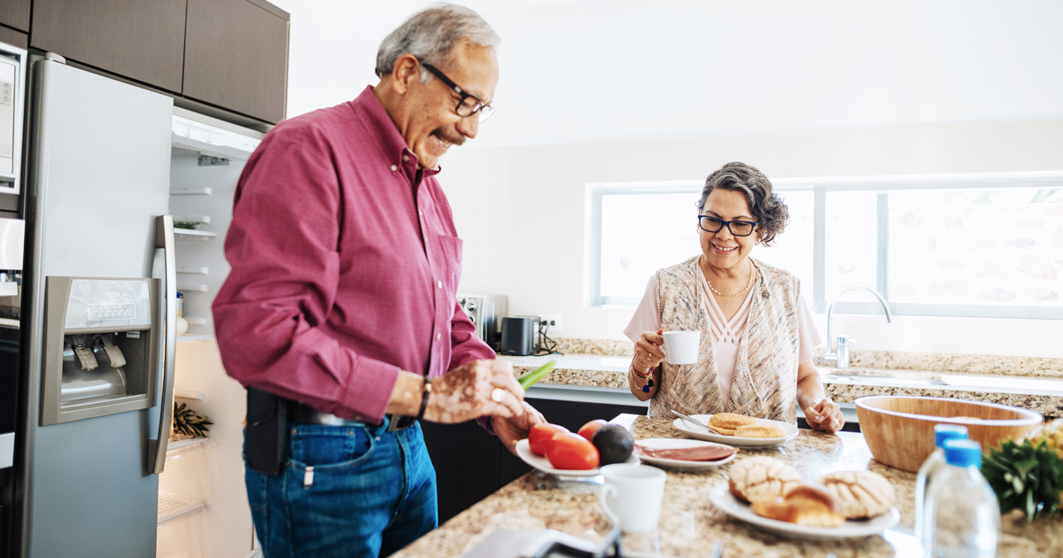 Man and woman making a meal in the kitchen