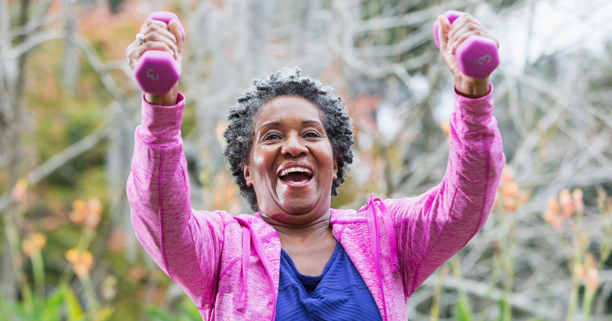 Older woman lifting hand weights