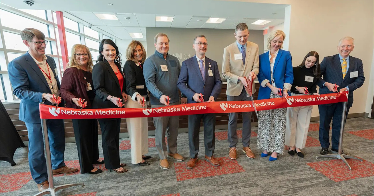 Nebraska Medicine leadership and physicians performing ribbon cutting at Bennington Health Center