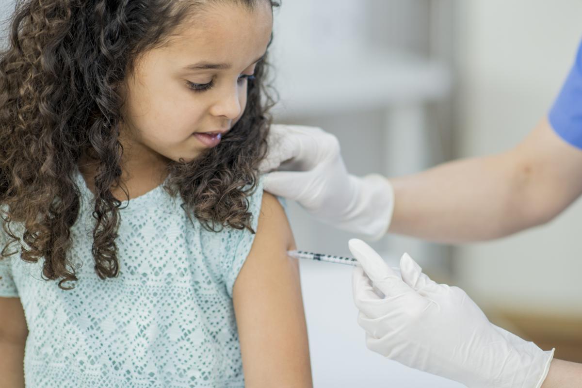 Young girl getting injection