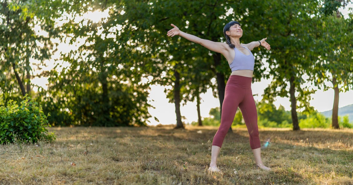 Woman doing yoga barefoot outside
