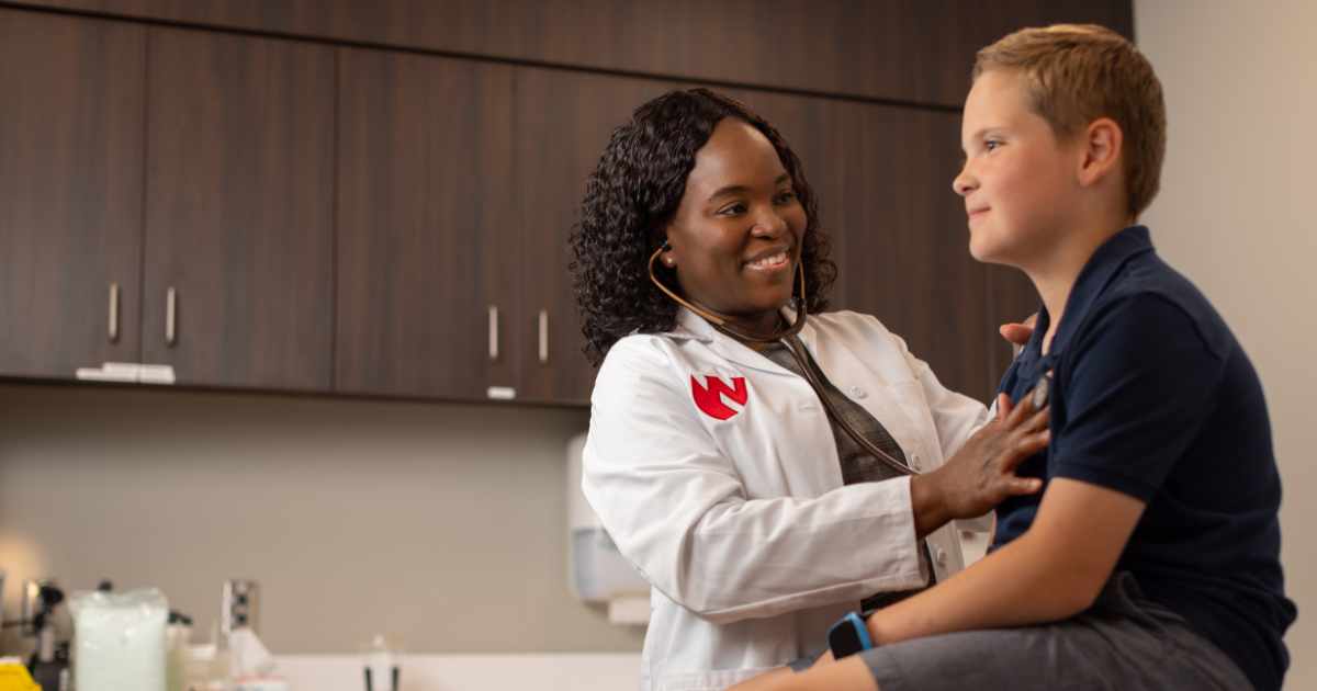 Nebraska Medicine physician with child patient