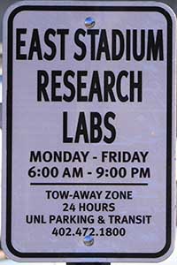 East Stadium Research Labs Parking Sign: Monday-Friday 6 a.m. - 9 p.m.