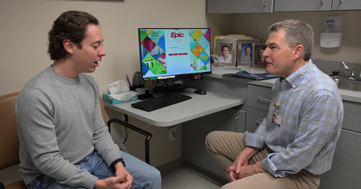 Patient Colin Gholson talking to Monument Health nephrologist, Louis Raymond, MD.