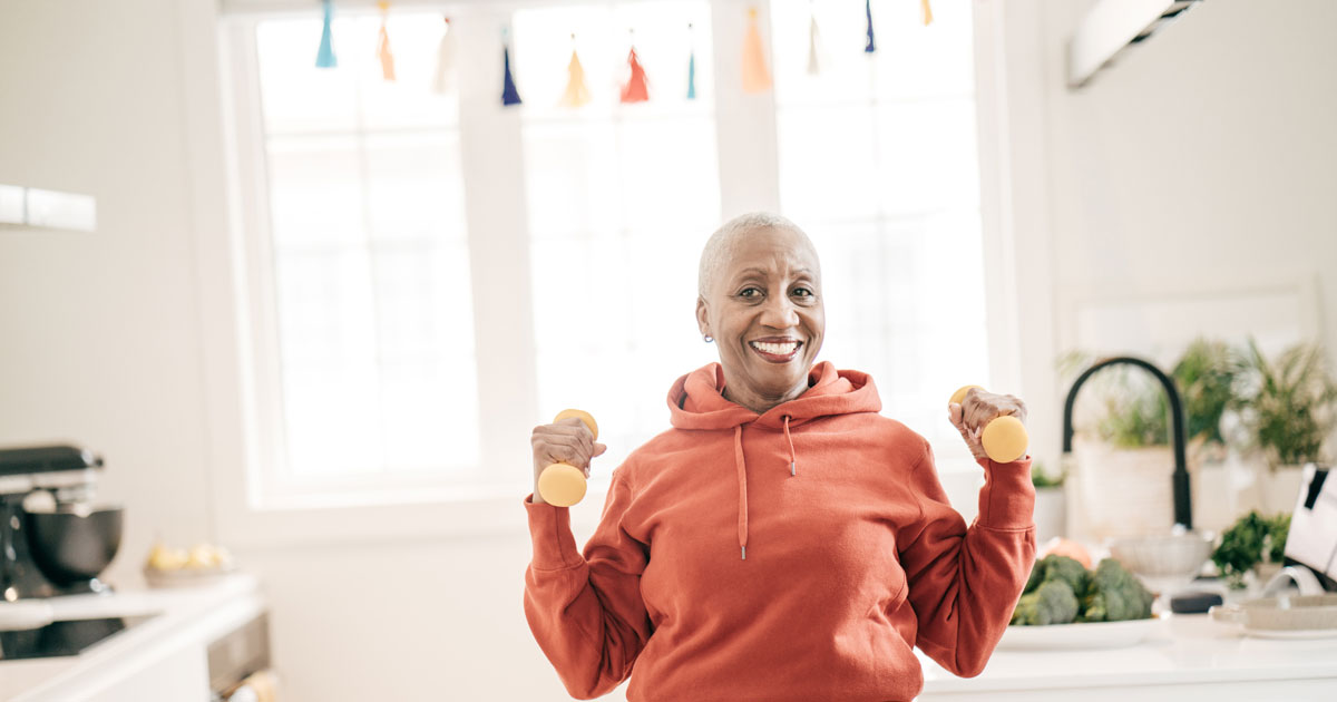 Woman holding dumbbells