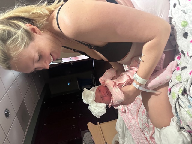 Desireè holding daughter Zola.