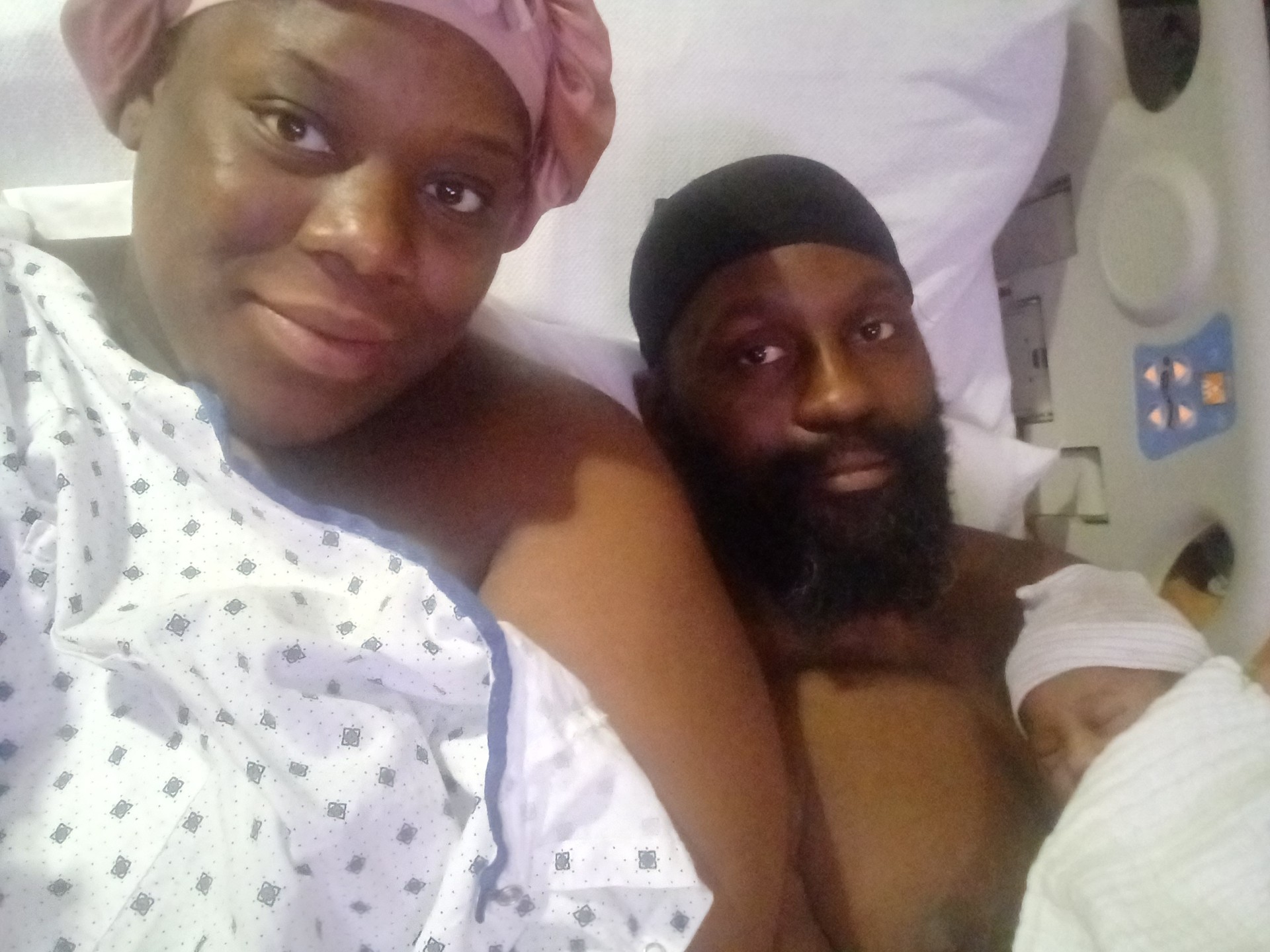 Rhea, partner Roshaun Garrett, and daughter My'Rhia