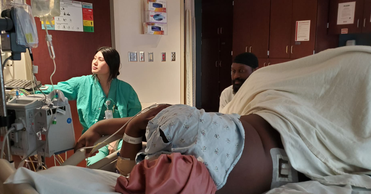 Patient Rhea Vinson, partner Roshaun Garrett, and nurse Lena Phan