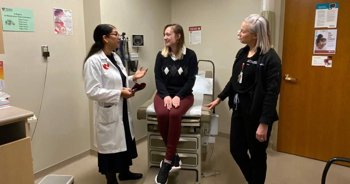 Sarosh Rana, MD and Teresa Stowe, APRN-NP talking to patient