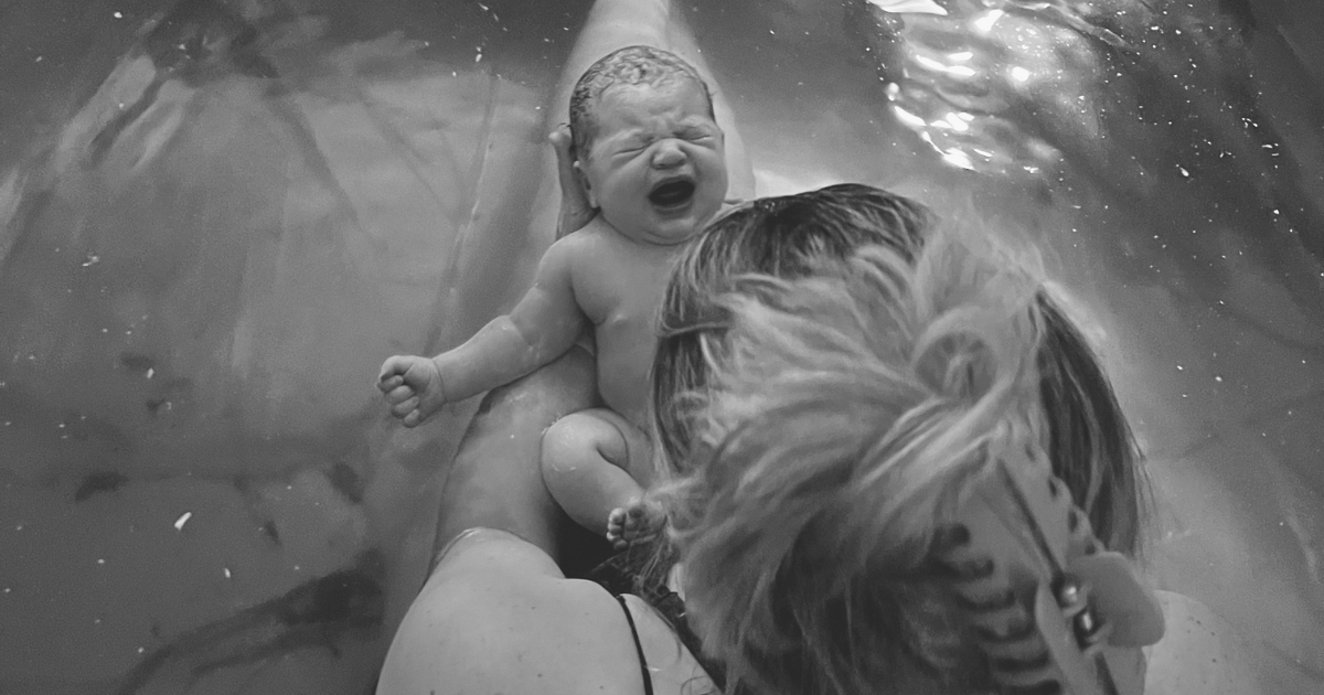 Jessica Schultze and daughter Margaret in water birth tub