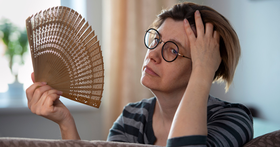 picture of a woman fanning herself