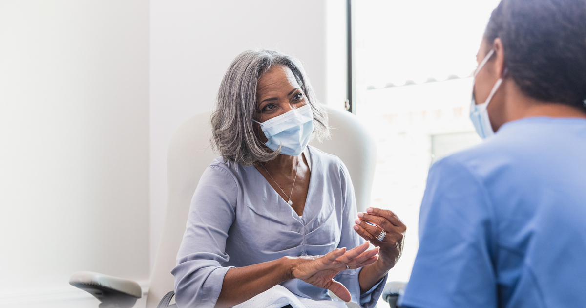 Older woman talking to her doctor