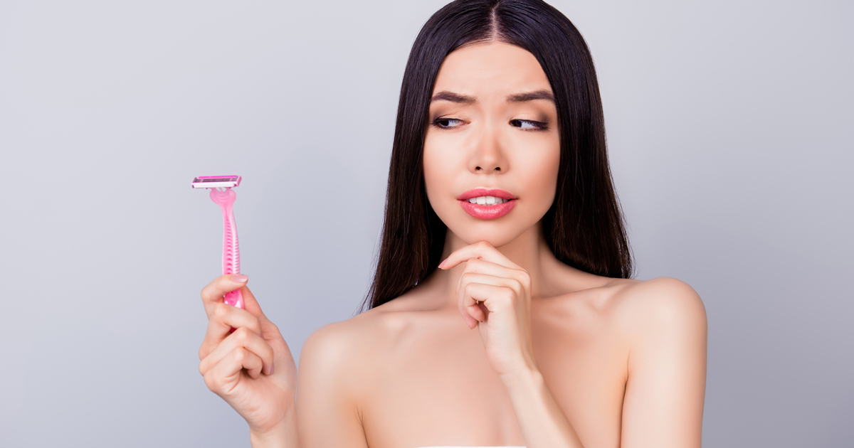 Woman holding a razor