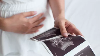 picture of a pregnant woman looking at ultrasound images