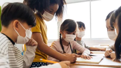 picture of a group of students in a classroom with face masks on