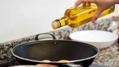 picture of cooking oil being poured into a pan