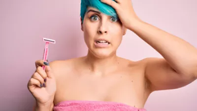 picture of a woman holding a razor