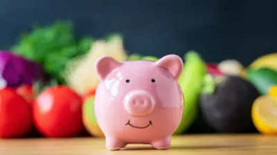picture of a piggy bank in front of vegetables