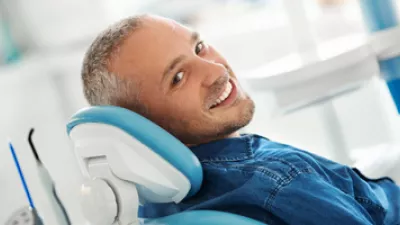 picture of a man in a dental chair