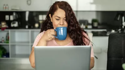 picture of a woman witting at her laptop