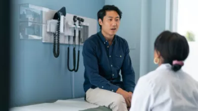 Picture of a man sitting in a doctor's office