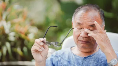 Man rubbing his eyes