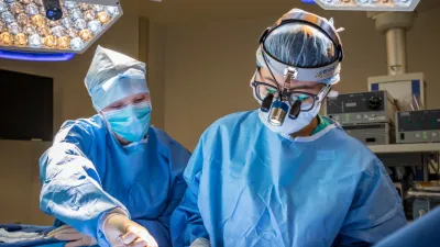 Shannon Wong, MD, works with a member of the care team