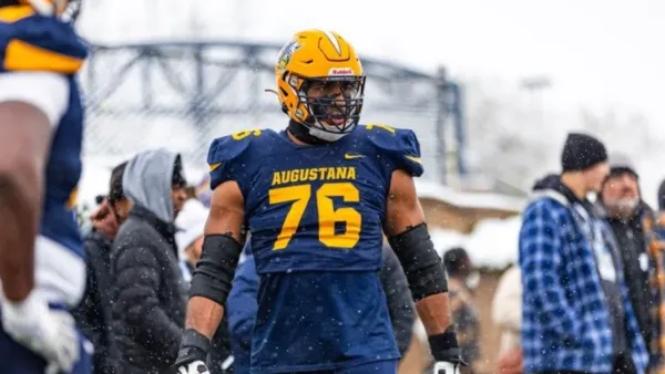 Shan Acharya playing football for Augustana University