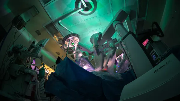 Wide shot of robotic surgery in progress