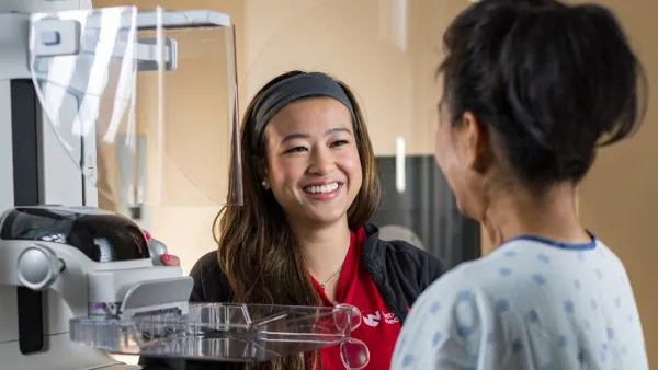 Woman talking to Nebraska Medicine mammographer