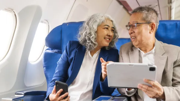 Man and woman sitting in airplane
