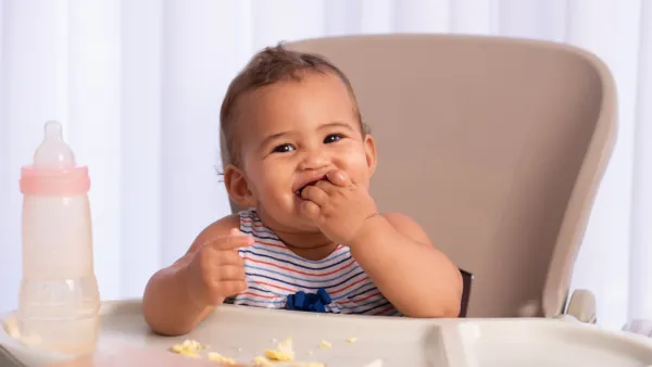 Baby eating eggs