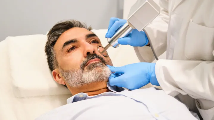 Man receiving laser resurfacing treatment