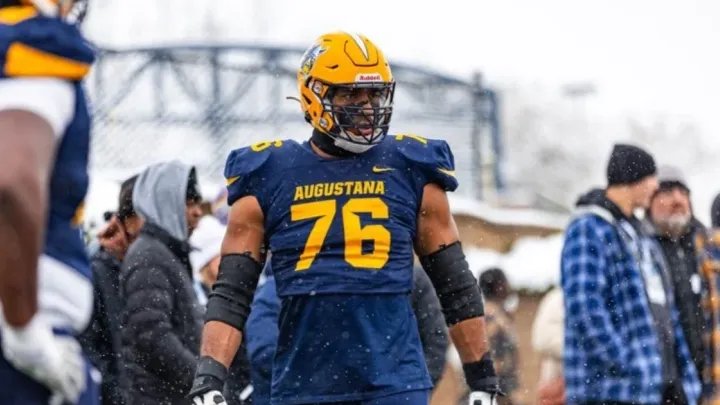 Shan Acharya playing football for Augustana University