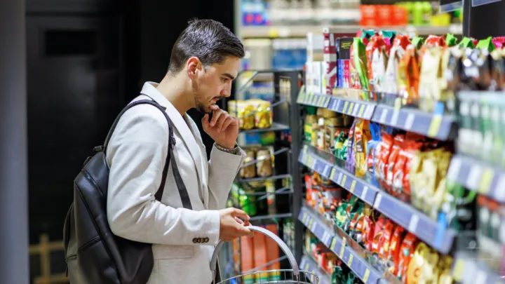 Man looking at grocery store shelf