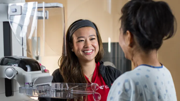 Woman talking to Nebraska Medicine mammographer