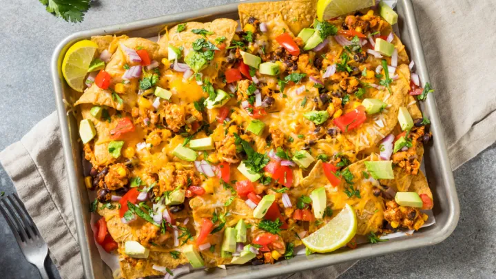 Homemade Vegan Loaded Sheet Pan Nachos with Tomato Cilantro and Lime