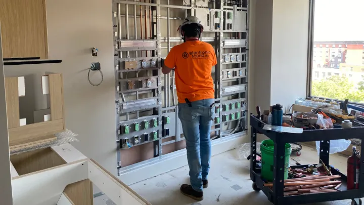 Construction worker in Clarkson Tower room