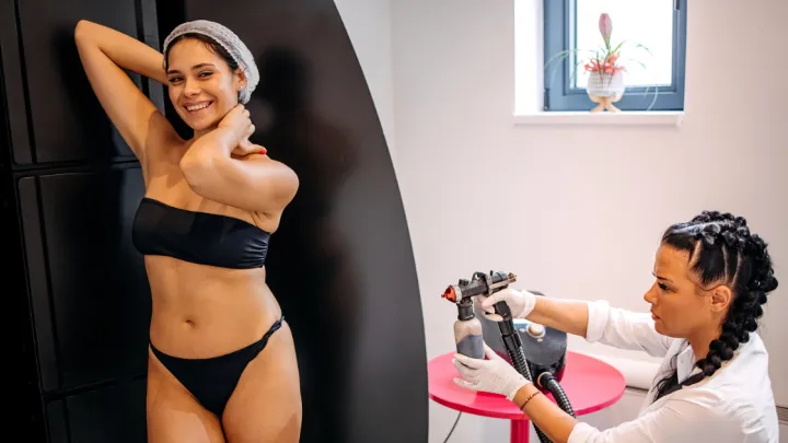 Woman getting spray tan
