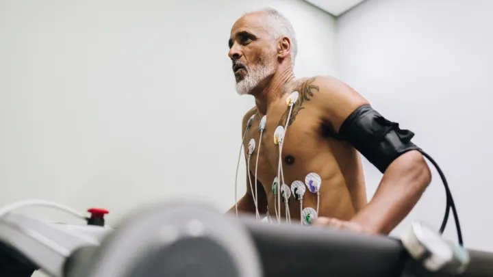 Senior patient taking cardiopulmonary stress test on a doctor's office