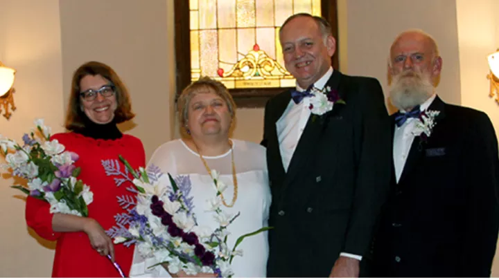 Lori Wiser and Dave Dyas with their wedding party, Julie Ostendorf (left) and Greg Solt (right).