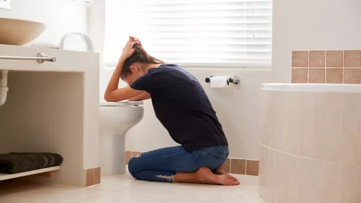 Woman sick in her bathroom