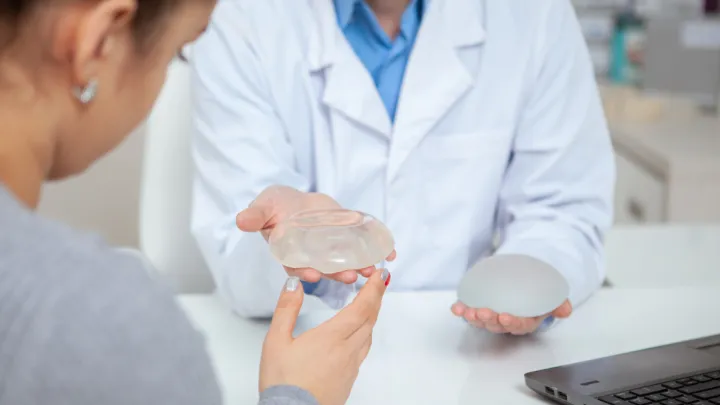 Woman in breast implant consultation